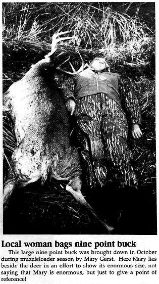 Photo of Mary Garst lying beside deer that she murdered